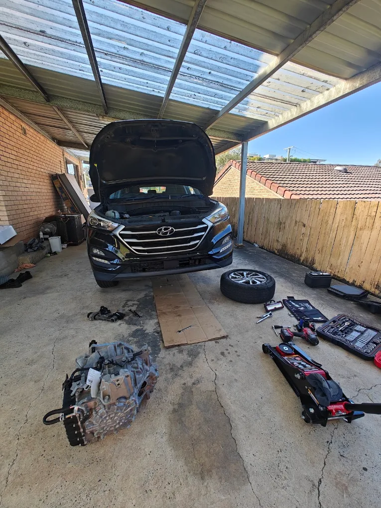 Transmission job in a carport